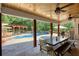Inviting backyard with a dining table, seating, and a view of the pool at 540 Benton Rd, Covington, GA 30014
