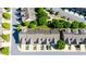 Aerial view of townhomes with well-maintained lawns, sidewalks, and tree-lined streets on a sunny day at 9872 Cameron Parc Cir, Johns Creek, GA 30022