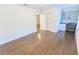 Bright bedroom featuring hardwood floors, closet, and a built-in desk with shelving at 9872 Cameron Parc Cir, Johns Creek, GA 30022