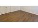 Bedroom showcasing hardwood floors, white walls, and a closet at 9872 Cameron Parc Cir, Johns Creek, GA 30022