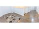 Hallway featuring hardwood floors, neutral paint and a rug, offering a clean and modern aesthetic at 9872 Cameron Parc Cir, Johns Creek, GA 30022