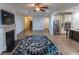 Spacious living room featuring a fireplace, modern ceiling fan, and open layout at 9872 Cameron Parc Cir, Johns Creek, GA 30022