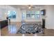 Bright living room with hardwood floors, fireplace, and large windows for natural light at 9872 Cameron Parc Cir, Johns Creek, GA 30022