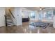 Open-concept living space with hardwood floors, staircase, and easy access to the kitchen at 9872 Cameron Parc Cir, Johns Creek, GA 30022