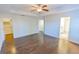 Spacious main bedroom with hardwood floors and adjoining rooms, including a closet and bathroom at 9872 Cameron Parc Cir, Johns Creek, GA 30022