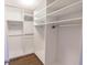 Walk-in closet featuring ample shelving for optimal organization at 9872 Cameron Parc Cir, Johns Creek, GA 30022