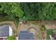 Bird's eye view of a property that backs up to lush green trees and has mature landscaping at 1105 Anemone Nw Way, Acworth, GA 30102