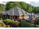 Community clubhouse featuring a large deck, pool, and dining areas, perfect for social gatherings at 1105 Anemone Nw Way, Acworth, GA 30102
