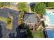 Aerial view of a clubhouse with parking, tennis courts, and a swimming pool at 1105 Anemone Nw Way, Acworth, GA 30102