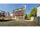 Backyard view featuring deck, patio, fire pit, and stair access at 1105 Anemone Nw Way, Acworth, GA 30102