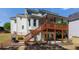 Expansive backyard featuring a large wooden deck and patio, ideal for outdoor entertaining at 1105 Anemone Nw Way, Acworth, GA 30102