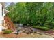 Backyard featuring a grill and access stairs to the deck and second-story outdoor seating at 1105 Anemone Nw Way, Acworth, GA 30102