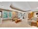 Basement area with exercise equipment, a couch, and large windows at 1105 Anemone Nw Way, Acworth, GA 30102