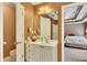 View of half-bathroom with single sink vanity and toilet, located off the main bedroom at 1105 Anemone Nw Way, Acworth, GA 30102