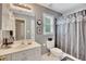 Bathroom featuring a vanity, a toilet, and a shower with a patterned curtain at 1105 Anemone Nw Way, Acworth, GA 30102