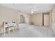 Spacious bedroom with a white ceiling fan, an area for a desk and neutral walls at 1105 Anemone Nw Way, Acworth, GA 30102