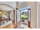 Welcoming home entryway showcasing an open door leading to the outside and a formal dining room at 1105 Anemone Nw Way, Acworth, GA 30102