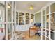 Bright home office offering built-in bookshelves, hardwood floors, and French doors at 1105 Anemone Nw Way, Acworth, GA 30102