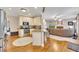 Open kitchen with granite counters transitions seamlessly into the living room at 1105 Anemone Nw Way, Acworth, GA 30102