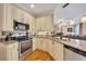 Kitchen features stainless appliances, granite counters, and a tiled backsplash at 1105 Anemone Nw Way, Acworth, GA 30102