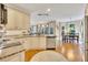 Bright eat-in kitchen features granite counters, stainless appliances and hardwood floors at 1105 Anemone Nw Way, Acworth, GA 30102