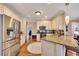Well-lit kitchen features stainless steel refrigerator and granite countertops at 1105 Anemone Nw Way, Acworth, GA 30102