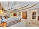 The main bedroom features an ensuite bathroom, a walk-in closet, and a tray ceiling with ceiling fan at 1105 Anemone Nw Way, Acworth, GA 30102