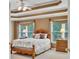 Spacious main bedroom features tray ceilings, two windows, and two nightstands at 1105 Anemone Nw Way, Acworth, GA 30102