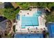 Aerial view of the community pool with lounge chairs and tennis courts nearby at 1105 Anemone Nw Way, Acworth, GA 30102
