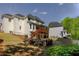 Exterior of home featuring rear deck, stairs, and a fire pit with retaining wall at 1105 Anemone Nw Way, Acworth, GA 30102