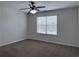 This bedroom features neutral walls, plush carpeting, and a ceiling fan with lights at 1632 Lenox Overlook Ne Rd, Brookhaven, GA 30329