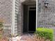 Close-up of front door and address number in brick facade with manicured landscaping at 1632 Lenox Overlook Ne Rd, Brookhaven, GA 30329