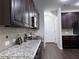 Well-lit kitchen with granite countertops, stainless steel appliances, and modern cabinetry at 1632 Lenox Overlook Ne Rd, Brookhaven, GA 30329