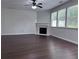 Bright living room with hardwood floors, a fireplace, and large windows for plenty of natural light at 1632 Lenox Overlook Ne Rd, Brookhaven, GA 30329