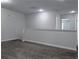 A carpeted loft space with neutral walls is versatile for various uses at 1632 Lenox Overlook Ne Rd, Brookhaven, GA 30329