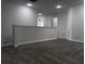 A carpeted loft space with neutral walls provides ample space and natural light at 1632 Lenox Overlook Ne Rd, Brookhaven, GA 30329