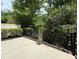 Concrete patio backing to green space offers a private outdoor space at 1632 Lenox Overlook Ne Rd, Brookhaven, GA 30329
