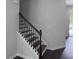Staircase with dark wood treads and white risers leading to the upper level of the home at 1632 Lenox Overlook Ne Rd, Brookhaven, GA 30329