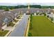 Aerial view of neighborhood showcasing manicured lawns and well-maintained townhomes at 2141 Slick Stone Dr, Snellville, GA 30078