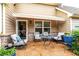 Comfortable back patio with outdoor seating, brick accents, and a retractable awning at 2141 Slick Stone Dr, Snellville, GA 30078