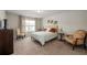 A bedroom featuring natural light from a window, a bed, and furniture at 2141 Slick Stone Dr, Snellville, GA 30078