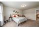 A cozy bedroom bathed in natural light, showcasing a comfortable bed and stylish decor at 2141 Slick Stone Dr, Snellville, GA 30078