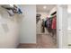 Walk-in closet with shelving for storage and racks for hanging clothing at 2141 Slick Stone Dr, Snellville, GA 30078