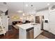 Modern eat-in kitchen with granite countertops, stainless steel appliances, and open floor plan at 2141 Slick Stone Dr, Snellville, GA 30078