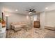 Cozy living room featuring neutral paint, stylish rug, sofa, and ceiling fan at 2141 Slick Stone Dr, Snellville, GA 30078