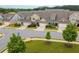 Overhead view of the townhome community displaying landscaping and tree-lined streets at 2141 Slick Stone Dr, Snellville, GA 30078