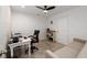 Bright office with a desk, chair, storage, and comfortable sofa, perfect for working from home at 2141 Slick Stone Dr, Snellville, GA 30078