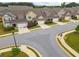 A street view highlighting the well-maintained landscaping and harmonious exterior colors at 2141 Slick Stone Dr, Snellville, GA 30078