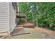 Multi-tiered deck and lush backyard of home with neutral siding and trim at 3463 Dunbar Ln, Suwanee, GA 30024