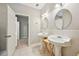 Bathroom featuring double sinks, tiled floors, and access to another room at 3463 Dunbar Ln, Suwanee, GA 30024